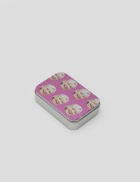 Tobacco tin with faces on