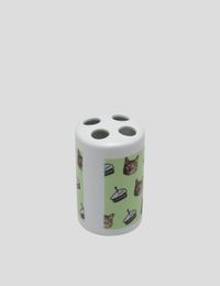 Ceramic toothbrush holder with face print