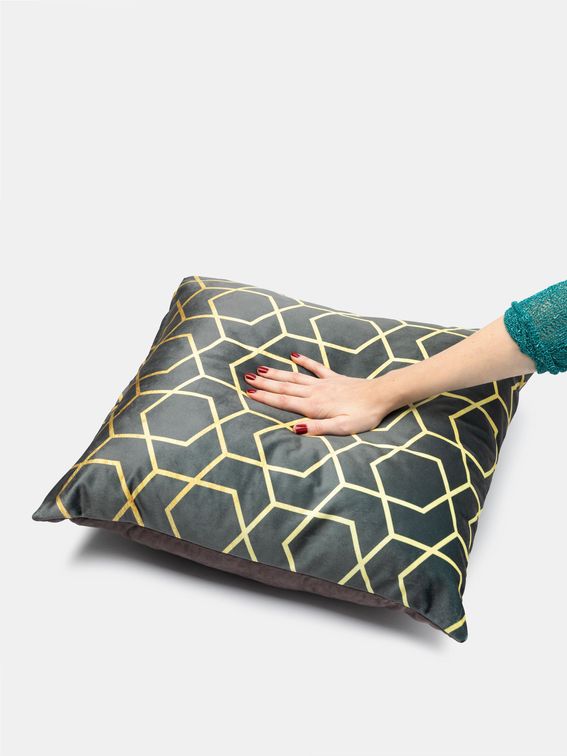 luxurious cushions on gold chair