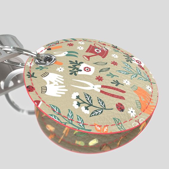Designer keyring in round shape with contrast edge stitching