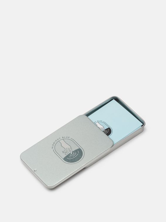 business card case with masculine office supplies and watches