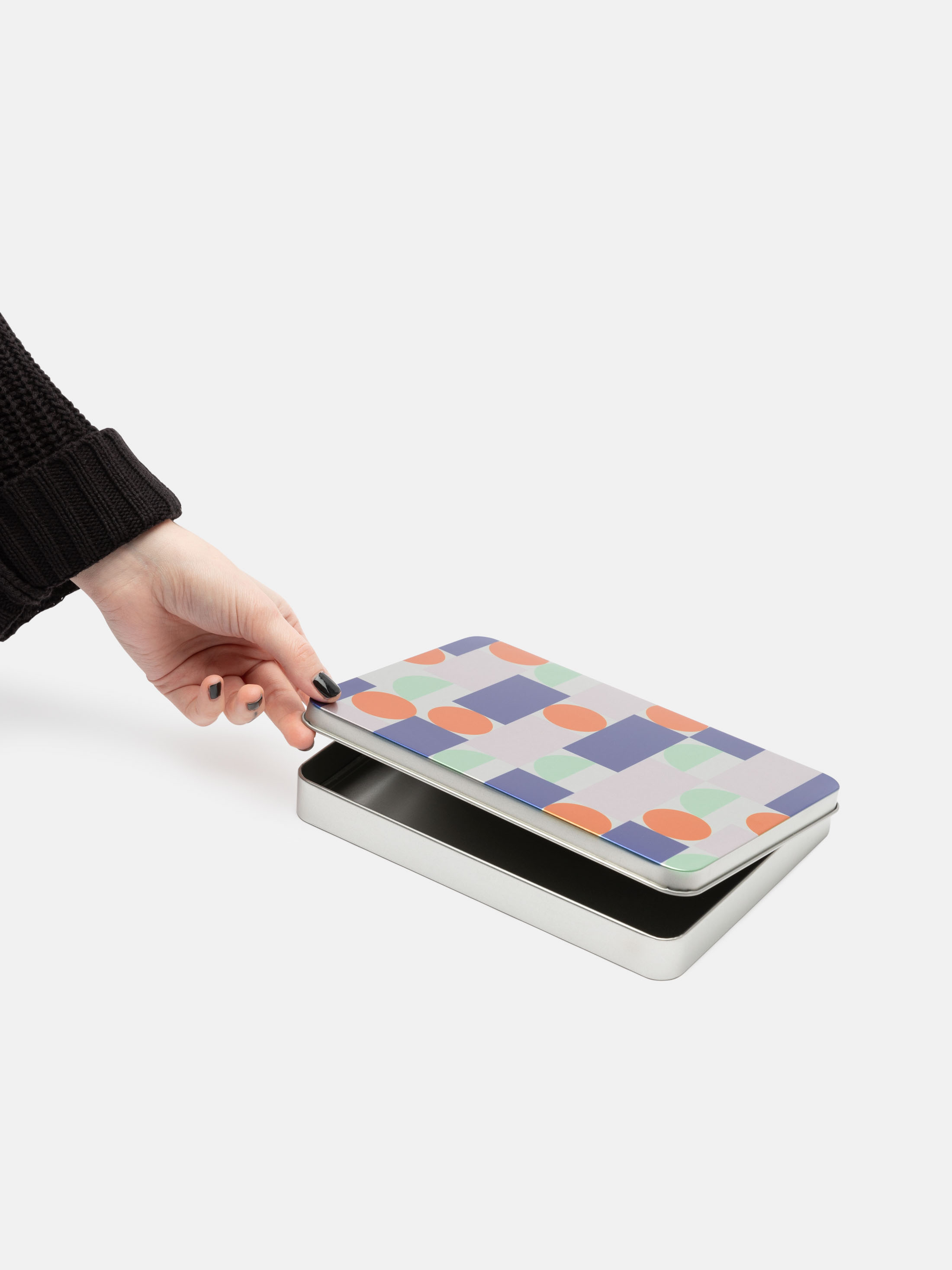 corner print details of tin box with hinged lid