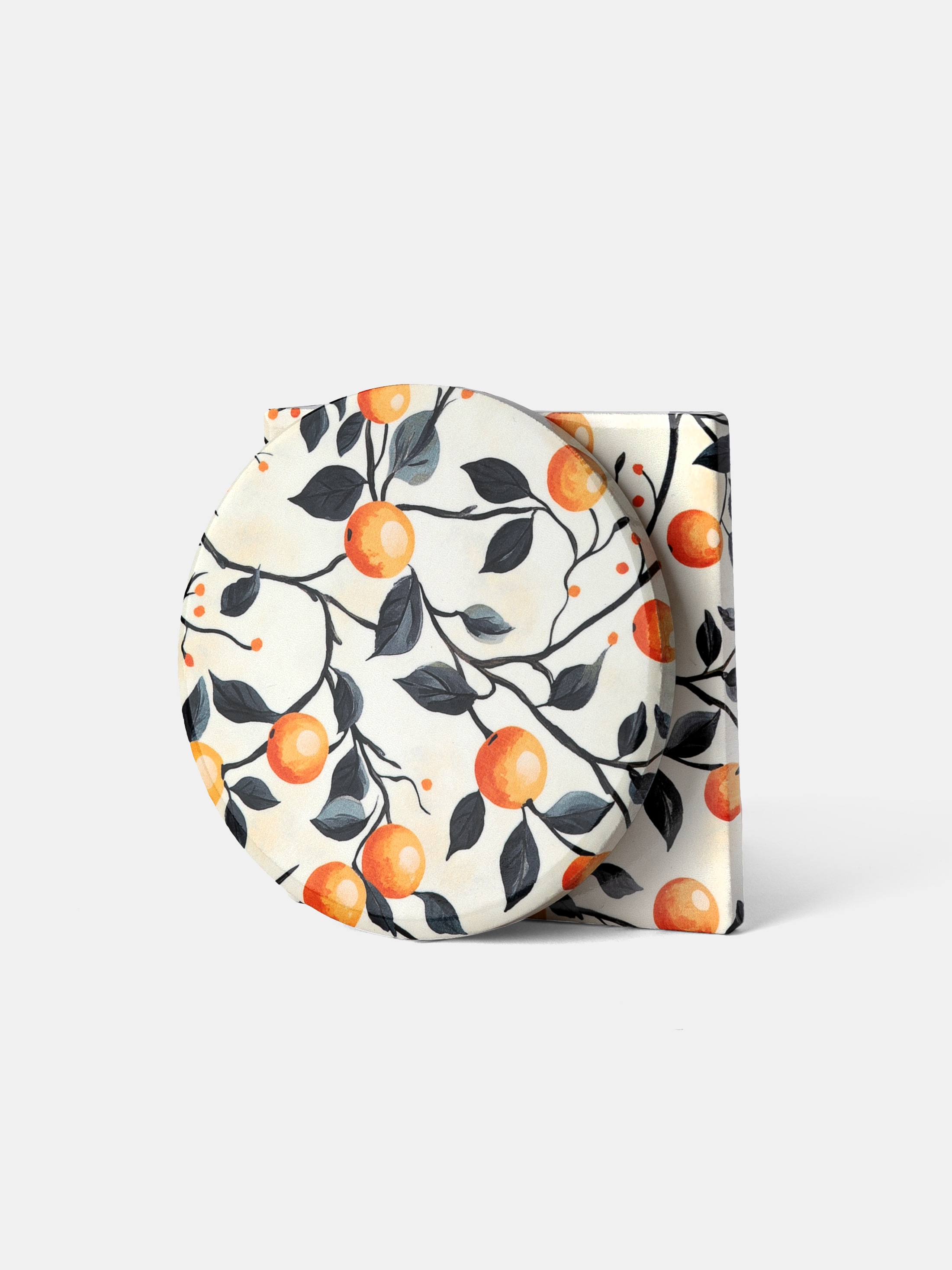 stack of custom ceramic coasters with orange fruit design