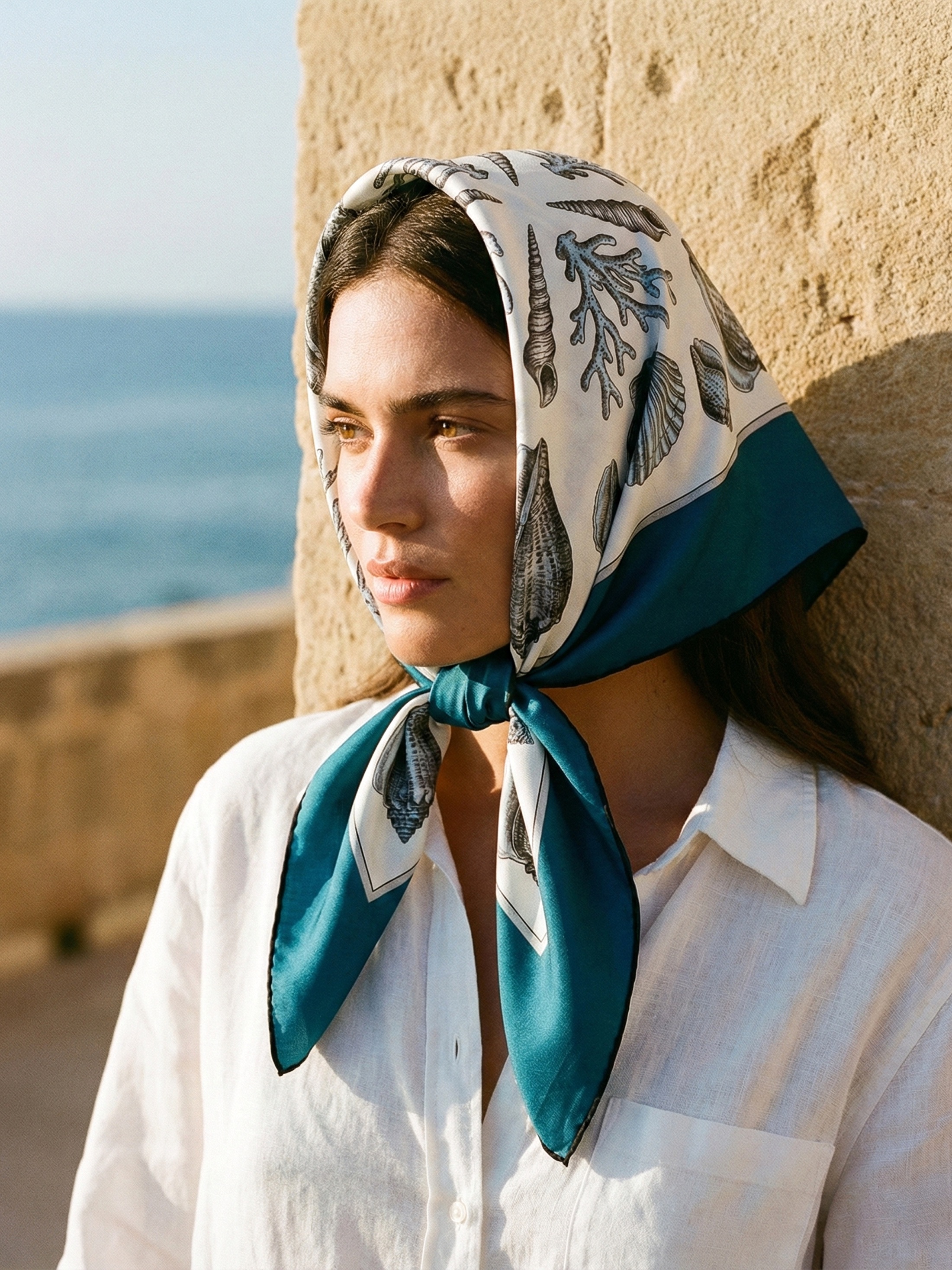 Personalised Scarf- Teal silk headscarf with shell print styled for summer resort wear.