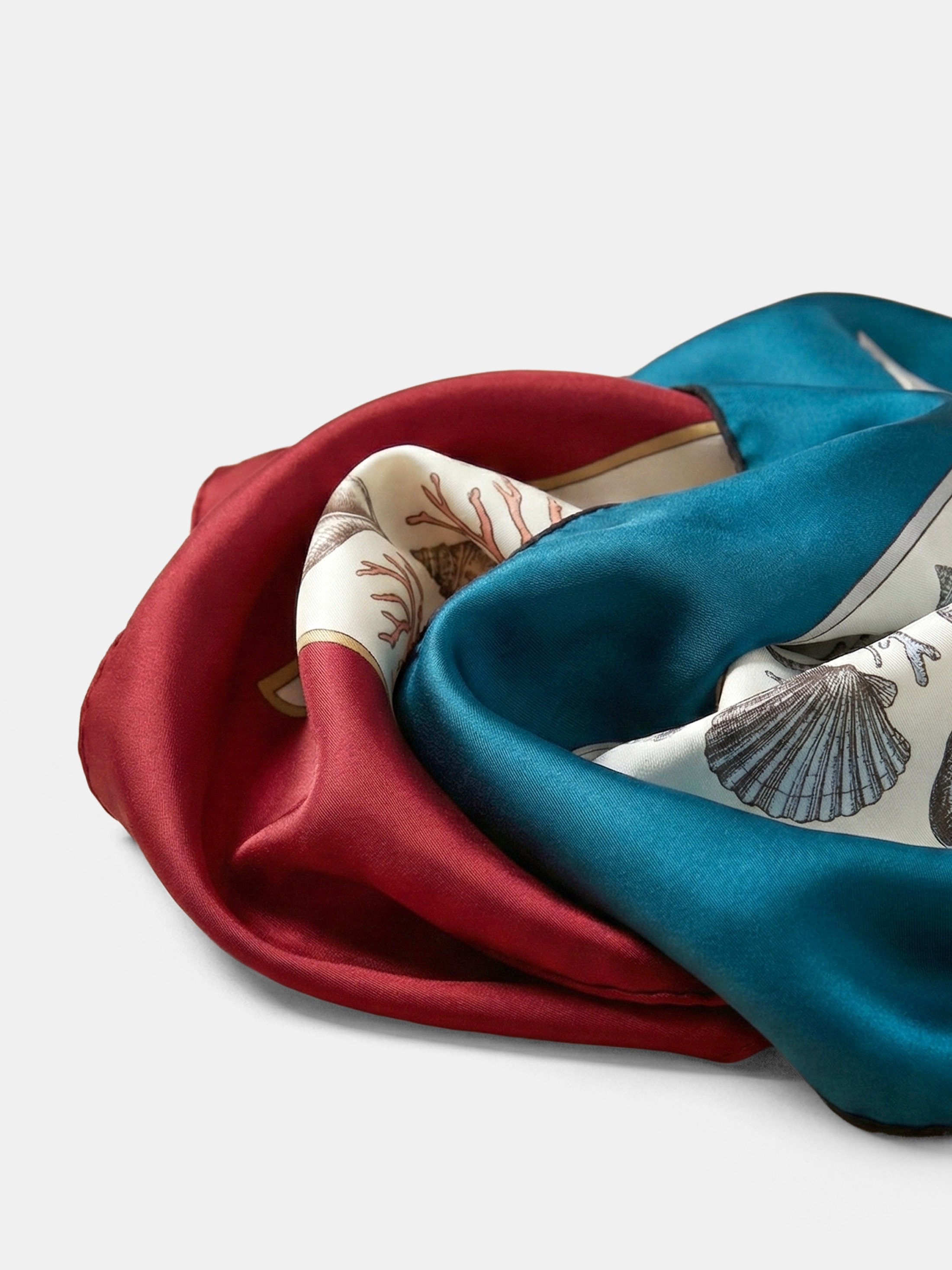 Custom silk scarf printing- Close up of luxury silk fabric texture showing hand rolled hem detail.